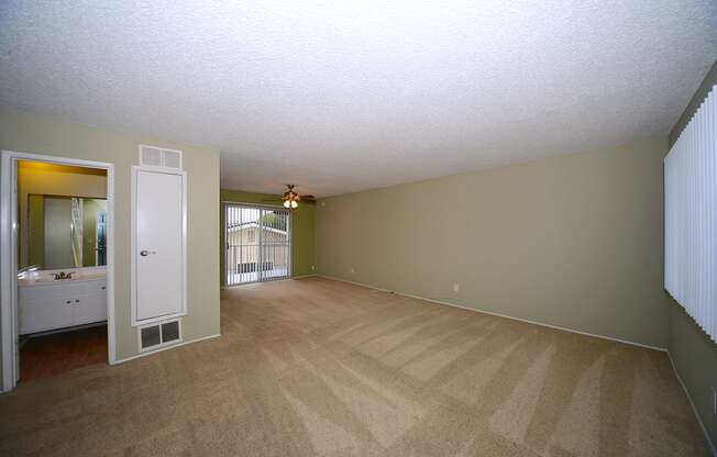 Ocean View Townhomes unfurnished living space with patio and ceiling fan