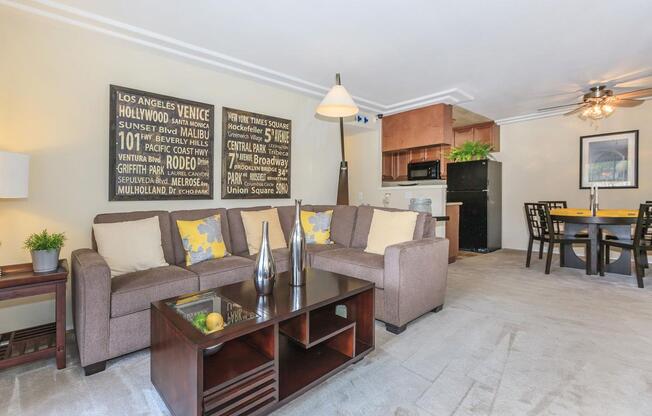 a living room filled with furniture and a tv