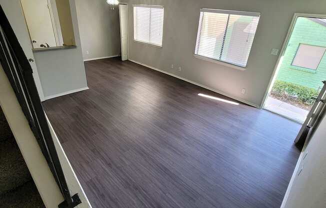 a view of a living room from the top of the stairs