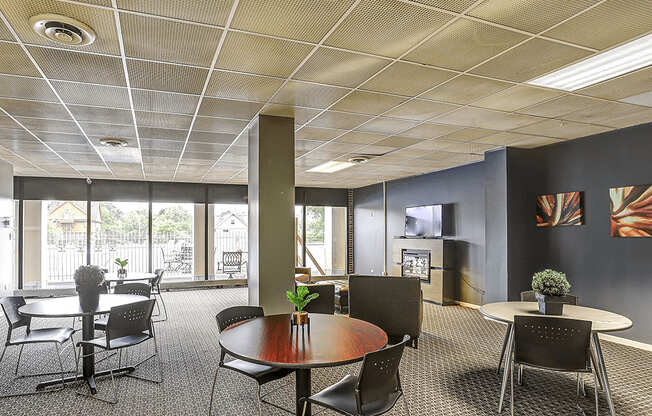 A conference room with a table and chairs.