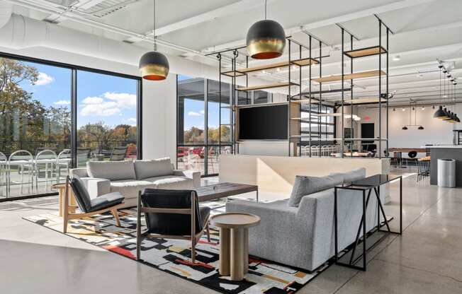 a living room with couches and chairs and a table