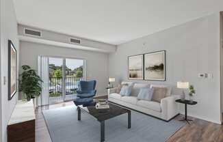 a living room with a couch and a chair and a sliding glass door