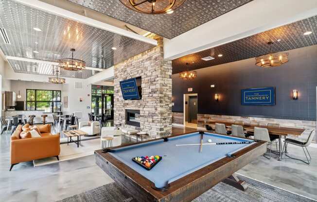 a pool table in the lobby of a club with tables and chairs at The Tannery, Connecticut, 06033