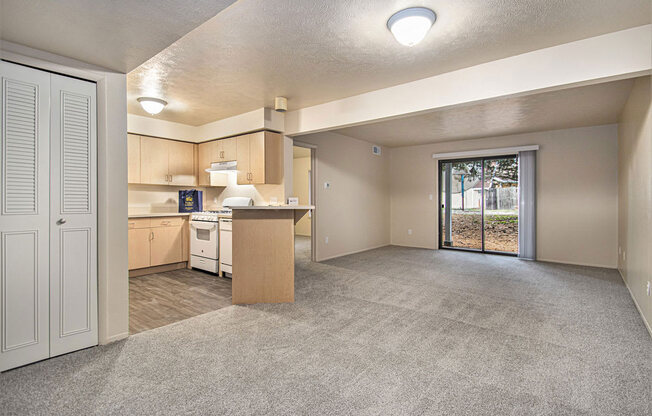 Two bedroom one bath living room with a door to patio
