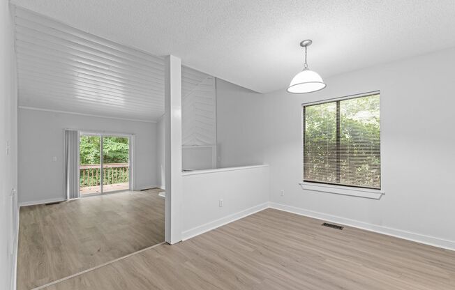 AVAILABLE NOW - Updated 2 Bedroom Duplex w/ Fenced-in Backyard, Large Deck, LVP Floors, Pet Friendly!