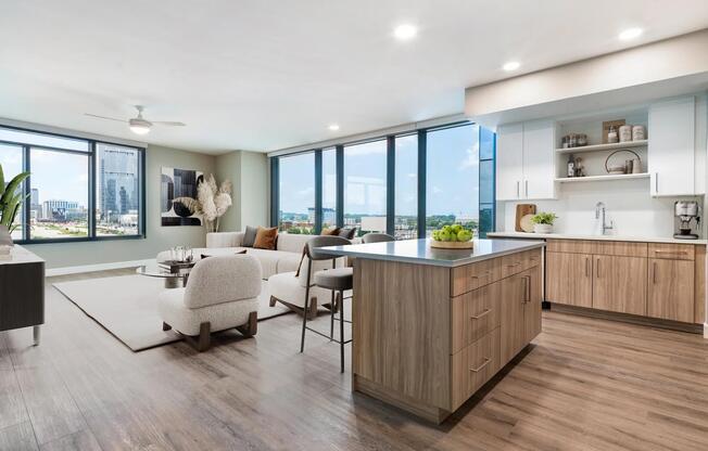 Enjoy a modern kitchen with 42” soft-close cabinetry with under cabinet lighting, quartz counters, and open shelving for added function and style.