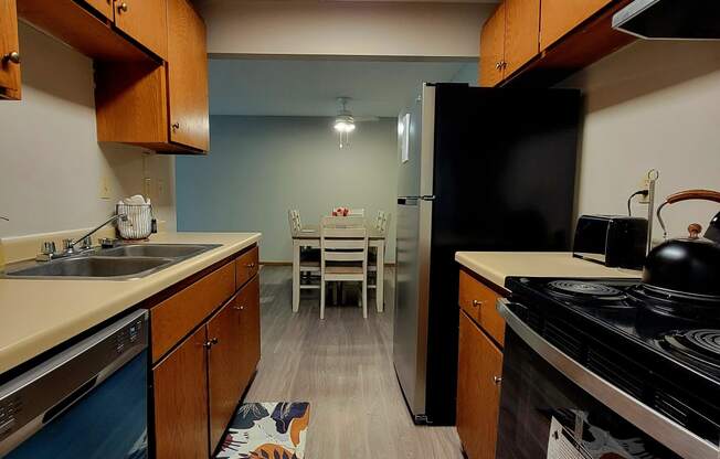 a kitchen with a stove and a sink and a table