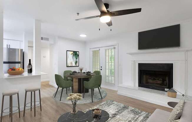 A modern living room with a fireplace and a dining table set up.