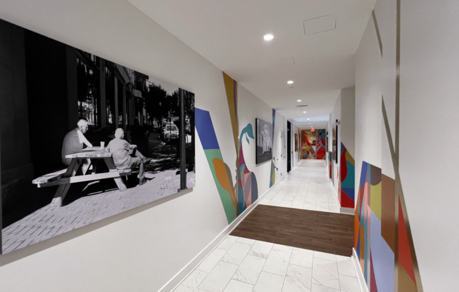 View Down a Hallway and Colorful Mural Art on the  at Link Apartments 4th Street in Winston-Salem, North Carolina