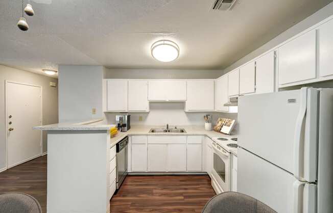 the preserve at ballantyne commons apartment kitchen with white cabinets and appliances