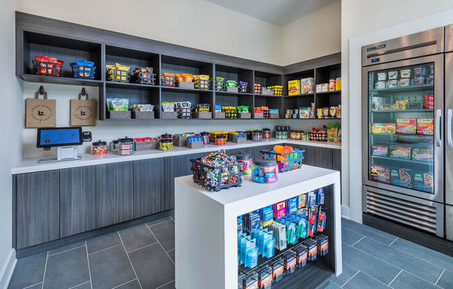 a store with a counter filled with food and a refrigerator