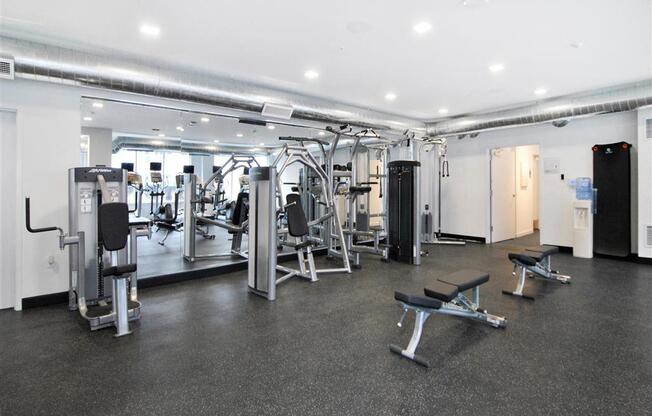 a gym with a lot of exercise equipment in it