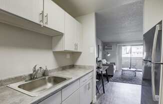 Hudson at Highline Apartments in Denver, Colorado Model Kitchen and View into Living Room