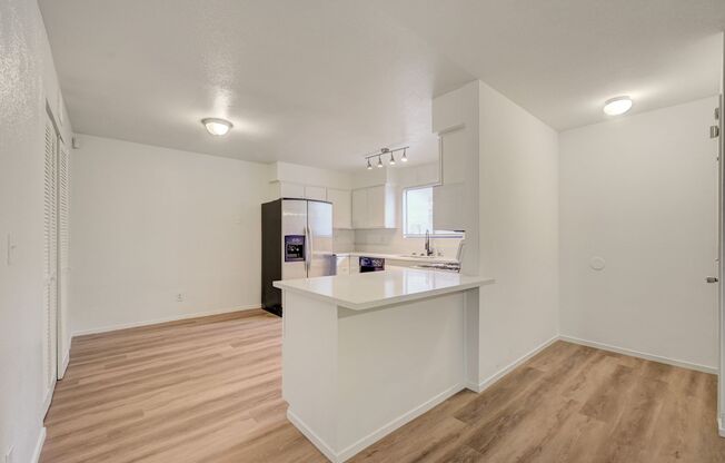Welcome to this beautifully remodeled ground-floor residence, ideally situated near Charleston and Rainbow.