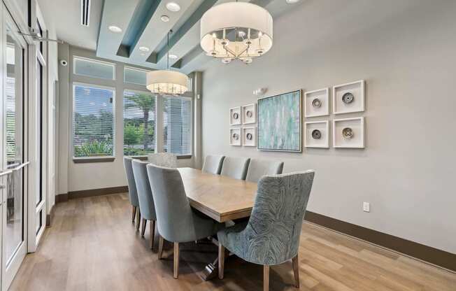 a dining room with a long wooden table and chairs