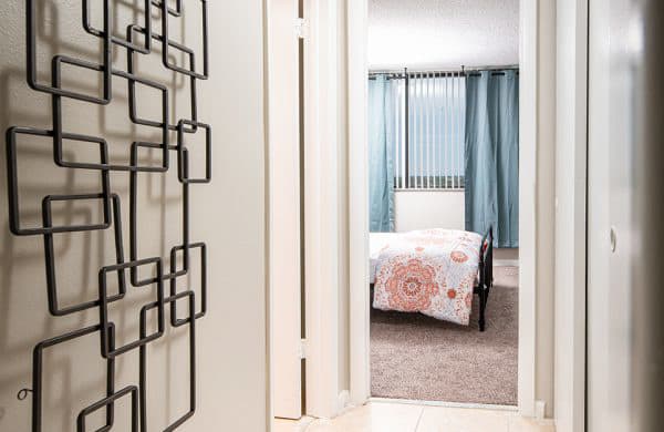 a bedroom with a bed in the reflection of a mirror at Fairways of Inverrary, Florida