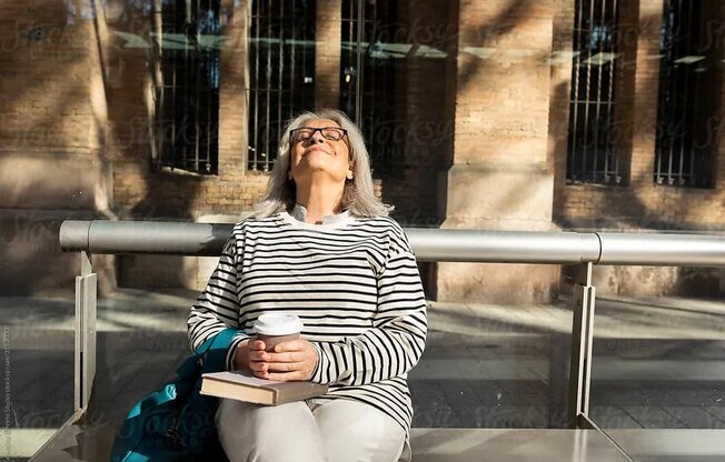 Woman With Coffee And Book at Sono Central Residential, Norwalk