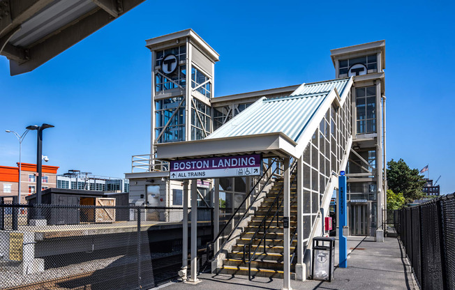 the entrance landing at the Boston Landing commuter rail stopion with stairs