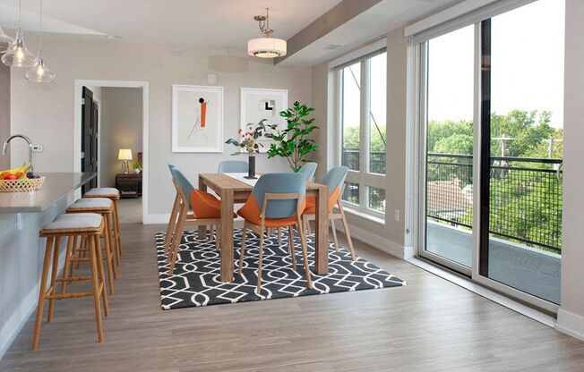 A dining room with a table set for six.