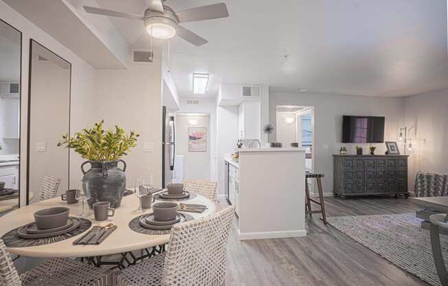 an open living room and dining room with a table and chairs