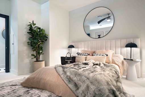 a bedroom with a bed and a mirror  at 220 Meridian, Indianapolis, IN 46204