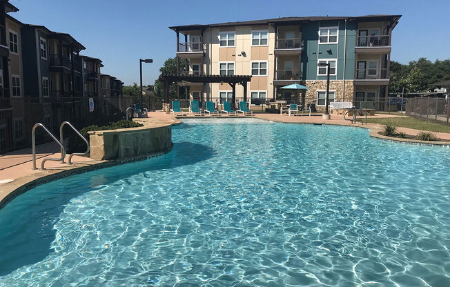 Invigorating swimming pool with sunning deck at CLEAR Property Management , The Lookout at Comanche Hill, San Antonio, TX, 78247