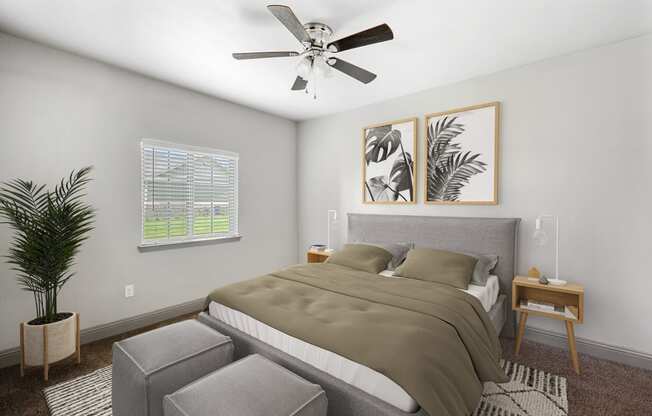 a bedroom with a bed and a ceiling fan