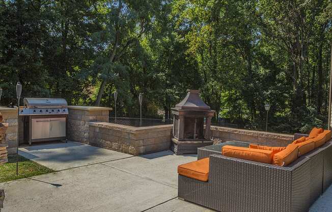 BBQ area with fire and couch area at Tysons Glen Apartments and Townhomes, Falls Church, VA, 22043
