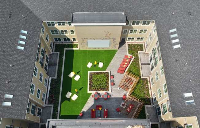 an aerial view of a yard in a building with grass