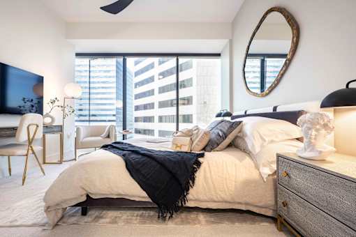 a bedroom with a large bed and a large window at 220 Meridian, Indianapolis, IN 46204