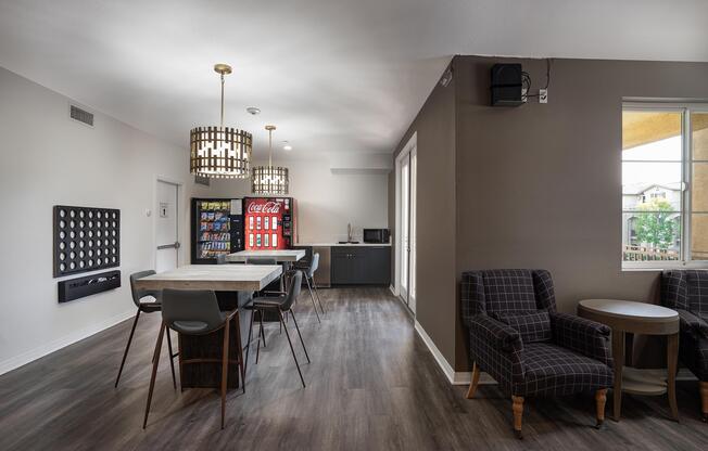 a living room filled with furniture and a large window