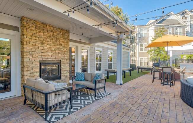Outdoor living area featuring a fireplace at Windsor Herndon, Herndon, VA