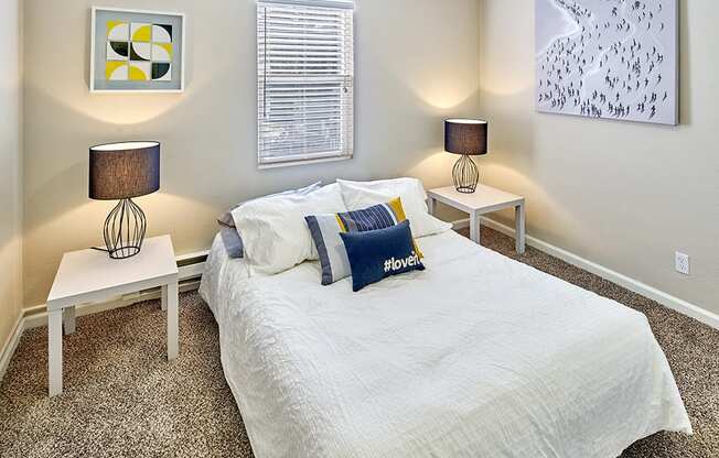 Carpeted bedroom to fit a queen sized bed and two side tables. One window over the bed.at Woodhaven, Everett, WA