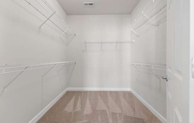 a spacious walk in closet offers lots of room for extra storage