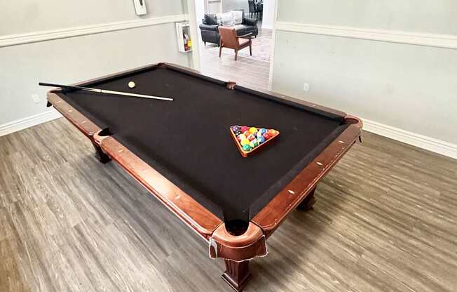 Campbell Plaza Apartments
710 Nido Drive, Campbell, CA 95008. A pool table in a room with light wood flooring.