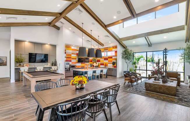 a living room with a dining room table and a kitchenat Weylyn Luxury Apartments, Laveen, AZ 85339