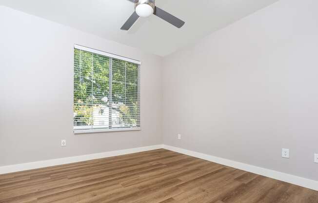 Apartments in Spring Valley, NV, for Rent - Alicante - Bedroom with Hardwood-Style Floor, Spacious Closet, and Large Window with Blinds