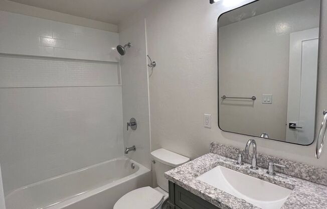 **Newly Renovated 2BDRM/1BTH with in unit laundry, private backyard and two parking spots!!**