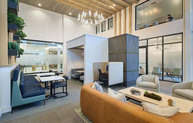 A modern living room with a brown sofa and a wooden ceiling.