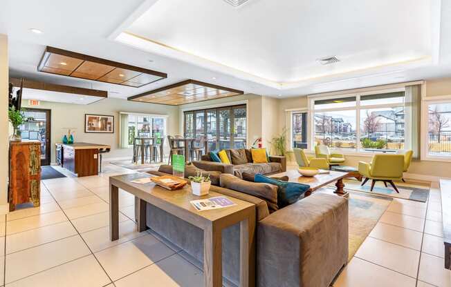 a living room with couches and chairs and a table