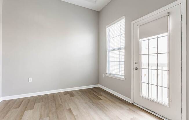 A room with a door and a window.