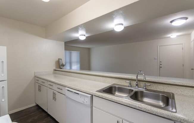 This is a photo of the kitchen of the 991 square foot 2 bedroom, 2 bath apartment at The Biltmore Apartments located in the Vickery Meadow neighborhood of Dallas, TX.