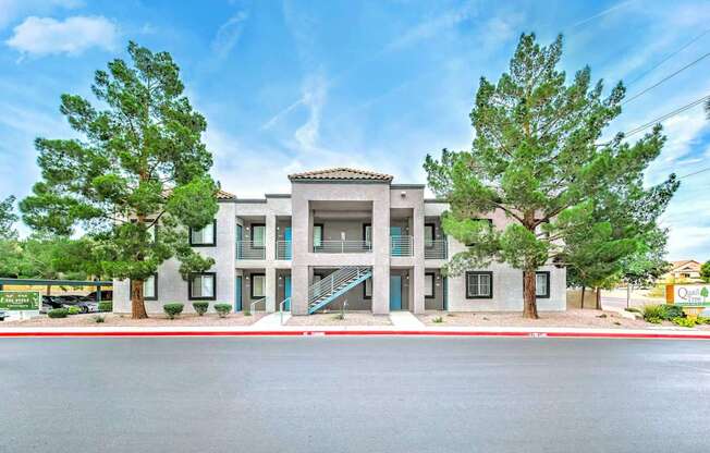 A building with a green lawn in front and a sign that says "Oak View".