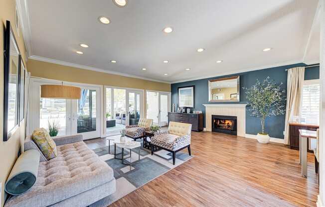 a living room with a couch and a fireplace