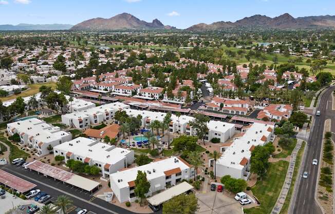 an aerial view of the community with mountains in the background