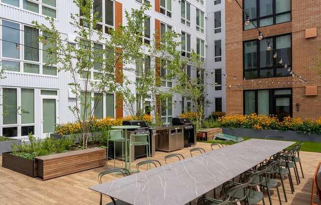 The Warren Apartments communal patio with dining area