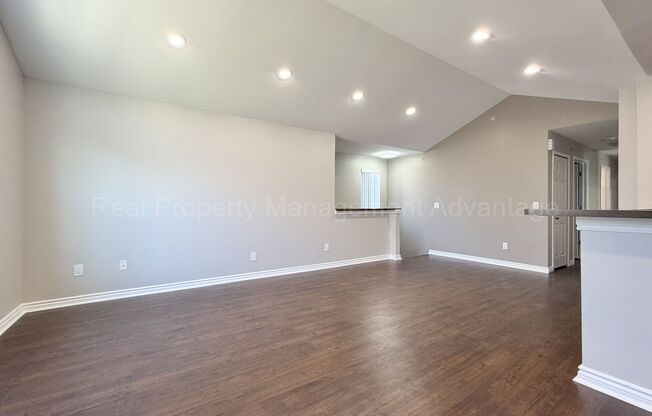 Rare Corner Upper Condo with Vaulted Ceilings, Private Balcony and 2 Car Garage - Right Across from the GM Tech Center!