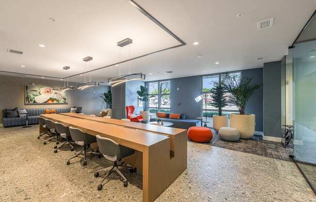 a conference room with a long wooden table and chairs