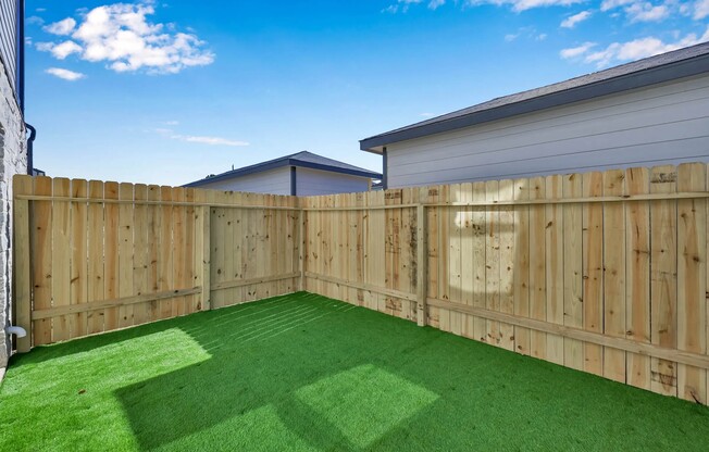 Discover outdoor bliss at Esperanza at Wild Orchid! Our inviting private yards feature lush artificial grass, perfect for relaxation or play. Enjoy a serene retreat just steps from your door. Schedule your tour today and experience the difference!