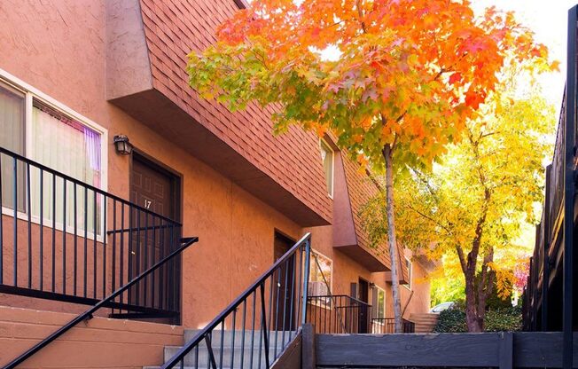 Red Trees Exterior at Oak Manor & Angel Street Apartments